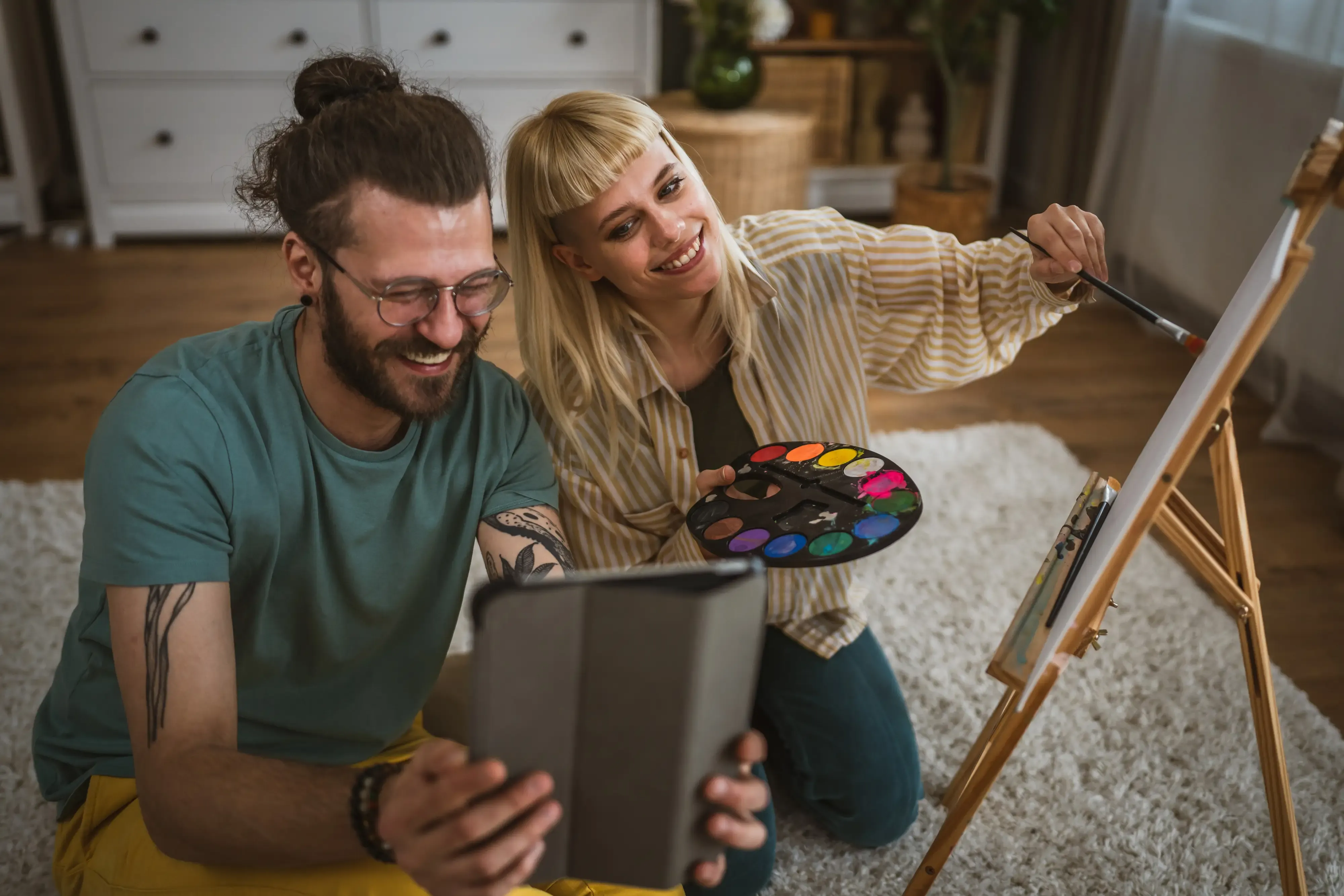 woman and man painting together